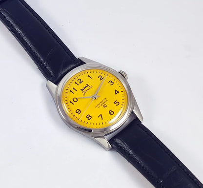 HMT Janata English Numerals Yellow Dial Para Shock 17 Jewels Transparent Back - Discover-Diamonds