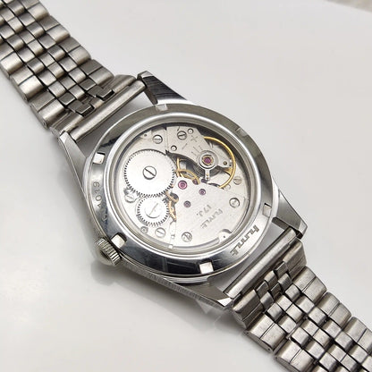 HMT Pilot Handwinding Watch - 17 Jewels Biscuit Color Dial with English-Stick Numerals and Transparent Back