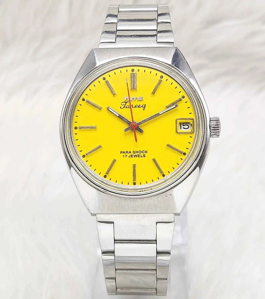 HMT Tareeq Men's Watch with Yellow Dial, 17 Jewels, Stick Indices, and Date Features