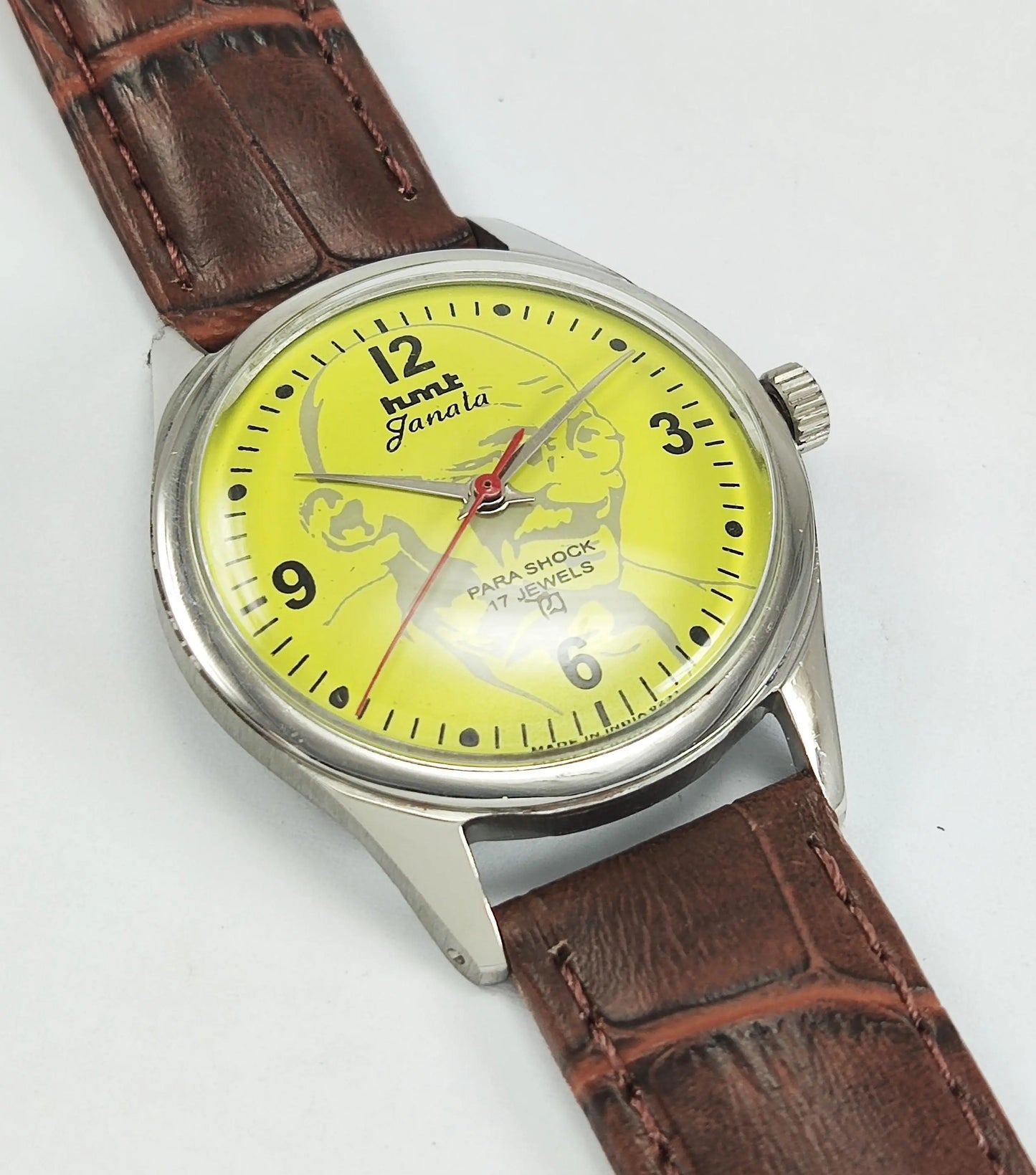 HMT Janata Para Shock 17 Jewels Mahatma Gandhi Yellow Dial Mechanical Hand winding Men's Wrist Watch - Discover-Diamonds